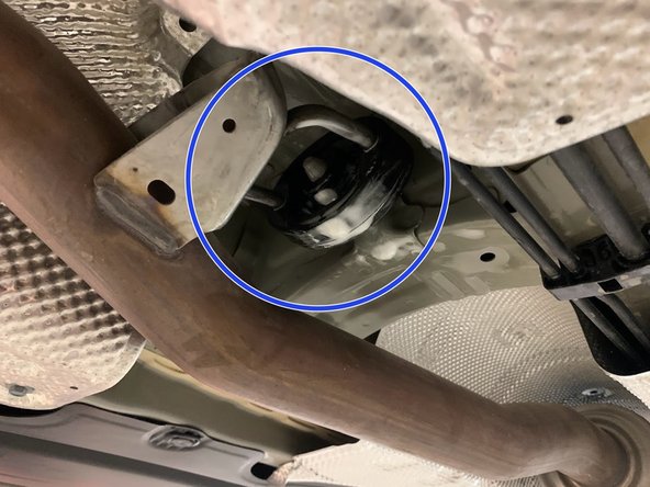 Using a spray cleaner, lubricate the front hangers and rubber support