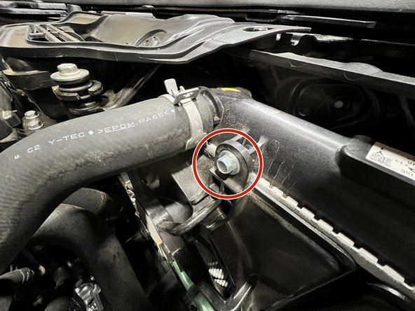 Install the supplied bracket in the orientation shown and rethread the 10mm bolt and torque to snug