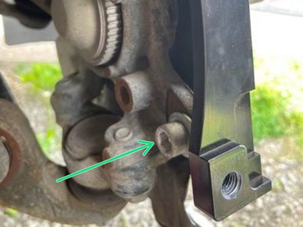 Insert the (2) short socket cap bolts from the backside