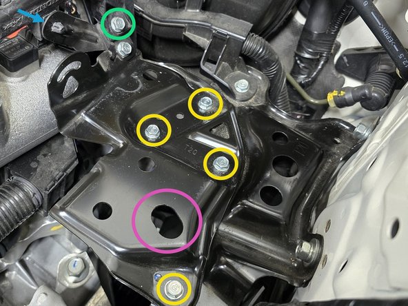 Thread the four mounting bolts as shown, then use a 10mm socket, a 6" extension, and a 3/8" drive ratchet to tighten them down