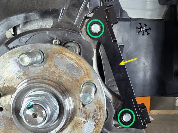 Install provided caliper bracket as shown