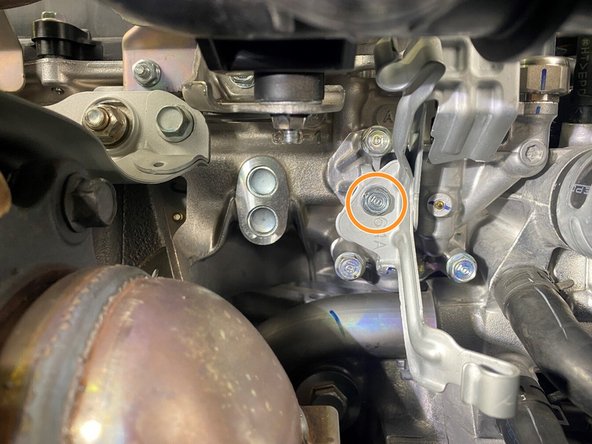 Reinstall the two (2) bolts and two (2) nuts securing the downpipe to the turbine housing. Torque to 33 ft-lbs