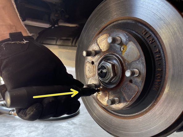 If there is a lot of corrosion around your rotor, spray with a bolt penetrant like PB blaster for easier removal