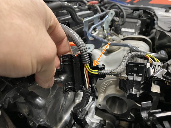 Place the the T-cover over the wiring loom as shown