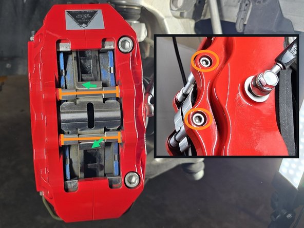 Using a 5mm Allen wrench, remove the two caliper bridge bolts