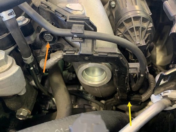 There are 2 bolts holding this bracket. The lower one is well hidden (yellow arrow)