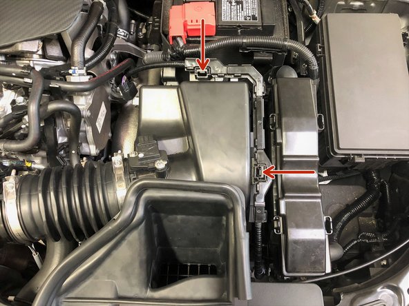 Install the MAF sensor wiring back onto the airbox by pushing downwards until the two clips click into place