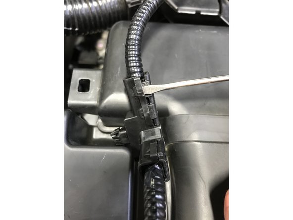 Using small flathead screwdriver, gently pry between the square loop and the prong, then pry the prong out of the loop