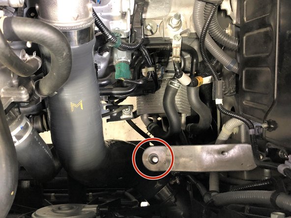 Insert the airbox into the engine bay in a similar manner that it was removed