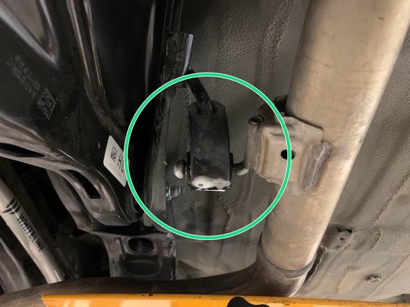 Using a spray cleaner, lubricate the remaining rear hangers and rubber supports