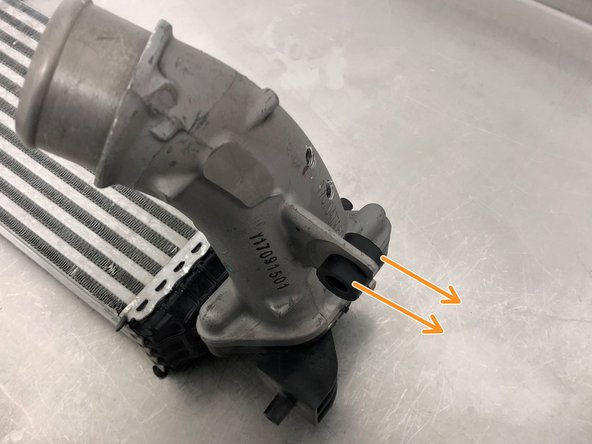 Squeeze the rubber grommet and slide it out of the OEM hot pipe