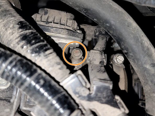 Loosen hose clamp as shown with 8mm socket, extension, and ratchet