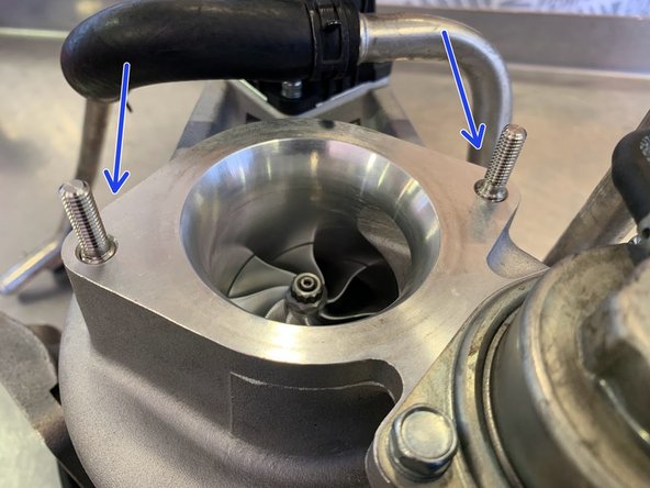 If your turbo did not come with two M8 studs and two M6 nuts for the turbo inlet pipe then skip this step. You'll reuse the OE bolts