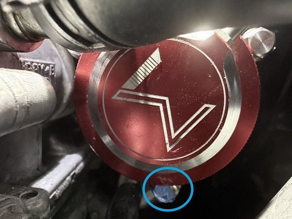 Pinch clamp on coolant line with a set of pliers then slide towards middle of hose. You will not be removing the hose itself