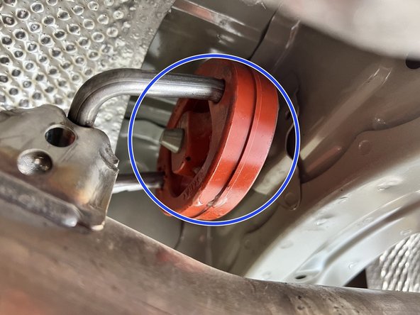 Using a spray cleaner, lubricate the front hangers and rubber support