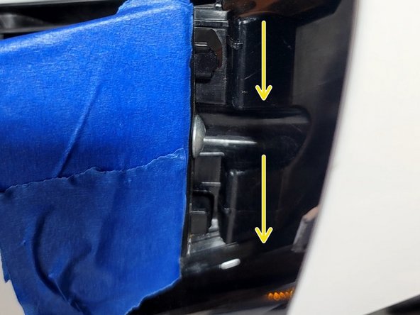 Note locking tabs at upper fenders. Slide each end of bumper into upper fender tabs