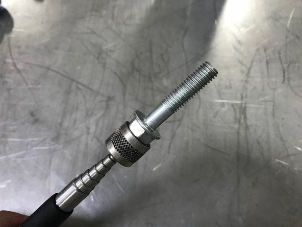 Using the Magnet on a Stick we can loosely thread the nut onto the stud and the bolts into the compressor housing without the risk of loosing the hardware in the engine bay