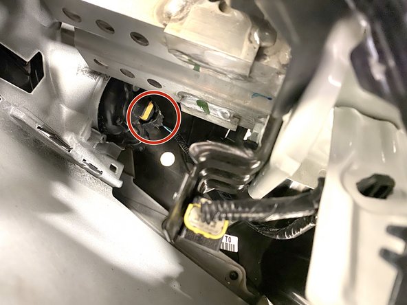 Lift the bumper close to the front of the vehicle