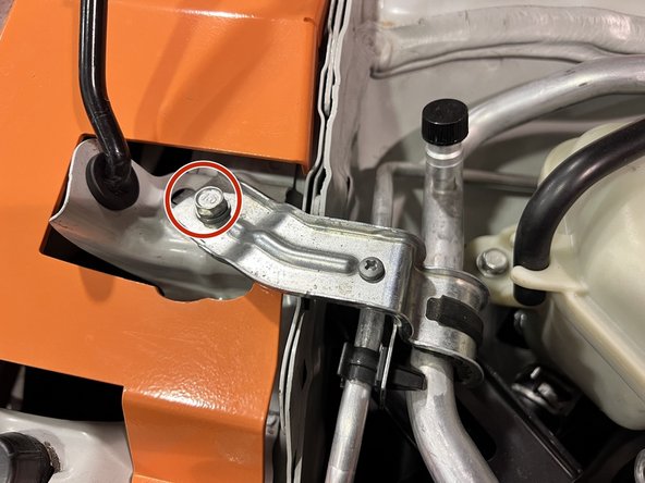 Use a 3/8&quot; ratchet and 10mm socket to remove the 10mm bolt securing the A/C hardline