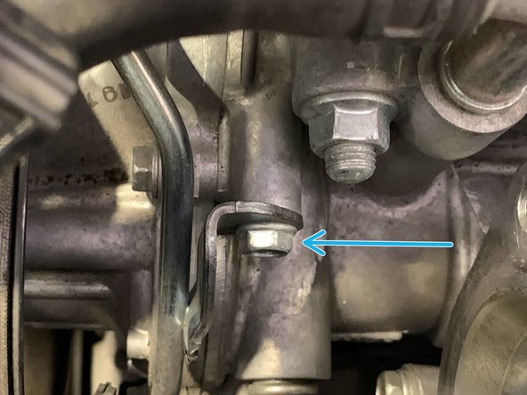 Remove the lower 10mm bolt holding the hardline