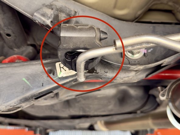 Pull the single rod hanger completely off the hanger rod and pivot out of the way as shown