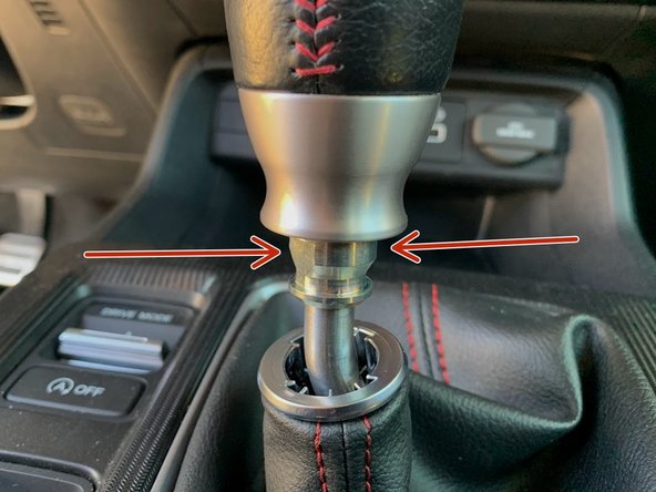 Locate the two flat spots on the OEM locking nut