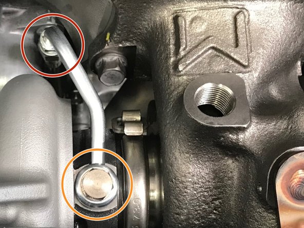 Install the assembled oil feed line onto the turbo