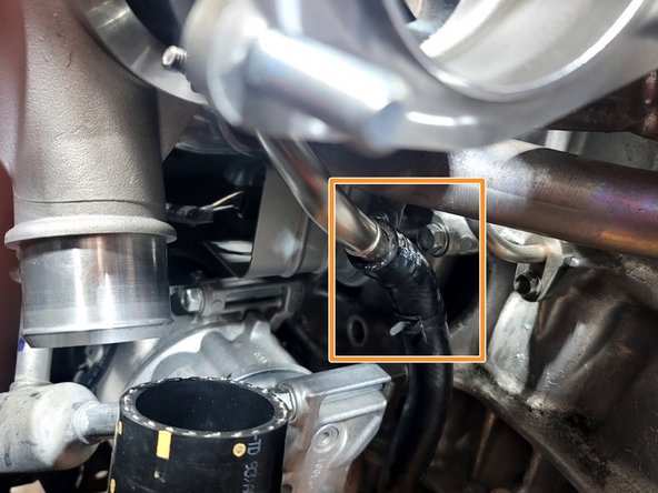 Reinstall rubber oil drain hose to turbo drain line