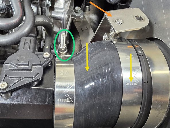 Lift the filter bracket up over the clamp as shown to verify your clamp position