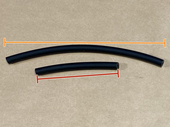 Install the short silicone hose onto the BPV hose barb (red circle)