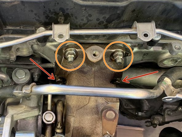 There are two 14mm bolts and two 14mm nuts holding the Turbo to the Cylinder Head