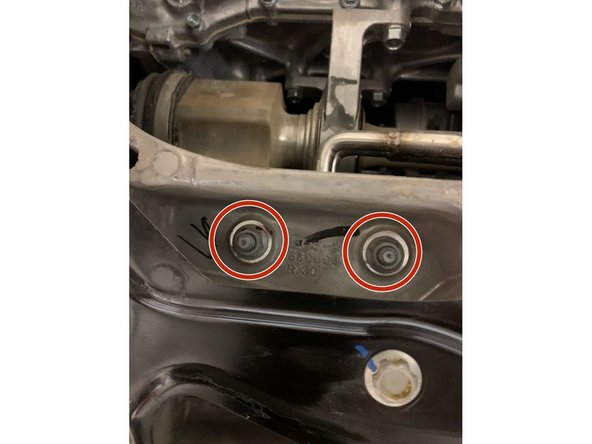 Using a 12mm socket, remove the bolts