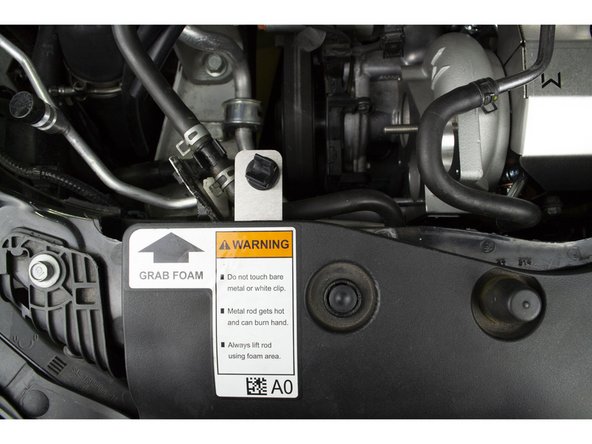 Reinstall radiator fan guard by inserting the 9 plastic clips and pressing down on them with your thumb