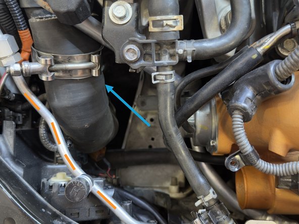 Using an 10mm socket and ratchet, loosen the bolt securing clamp around Boost Tube. 27WON Boost Tube shown. OEM will be similar