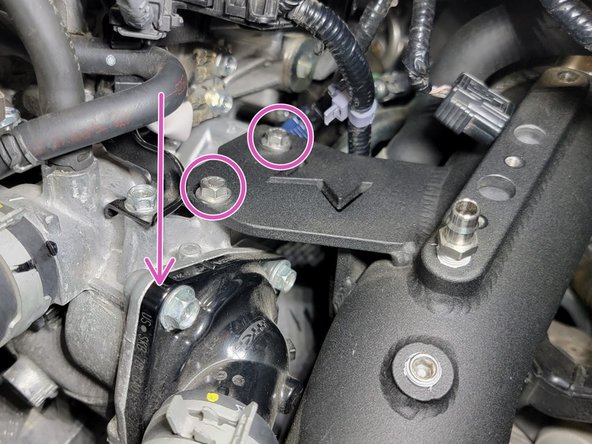 Push cold pipe down so its bracket is flush with the engine while using a 10mm socket and ratchet, secure both 20mm M6 bolts on the cold pipe bracket