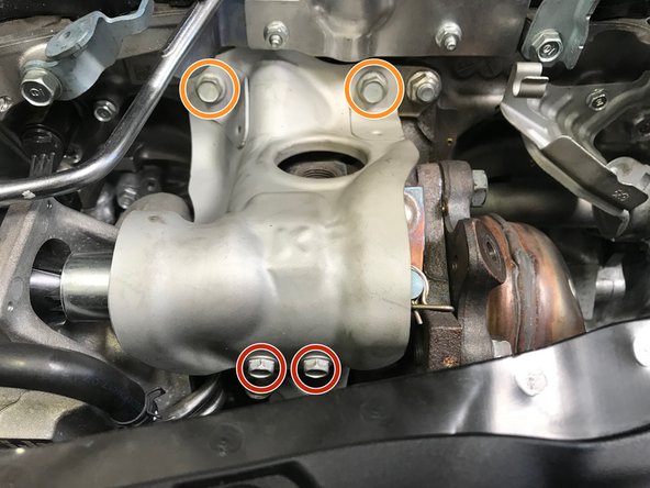 Use a 10mm wrench to remove the two (2) 10mm bolts