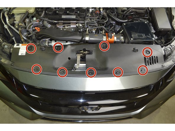 Reinstall radiator fan guard by inserting the 9 plastic clips and pressing down on them with your thumb