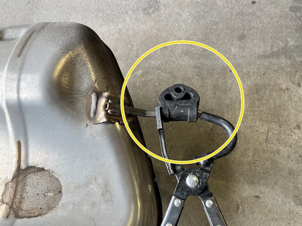 Slide hanger onto 27WON exhaust in direction shown