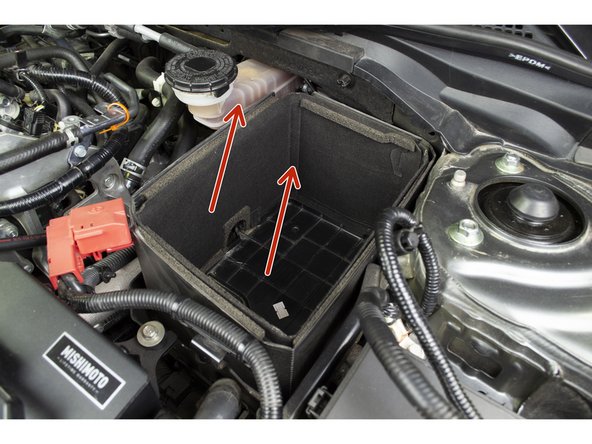 Remove the battery foam and tray case to reveal the battery bracket.