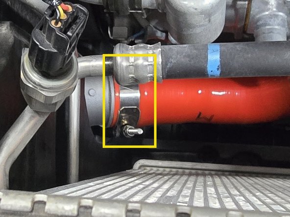 Correctly position the 60-68mm clamp on the intercooler and tighten with a 10mm socket, a 12" extension, and 3/8" drive ratchet until the silicone starts to bulge slightly at the edge of the clamp