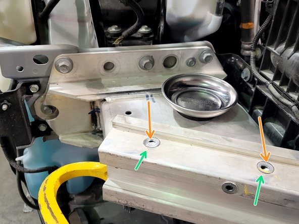 Line up aluminum bumper back on car using a rubber mallet