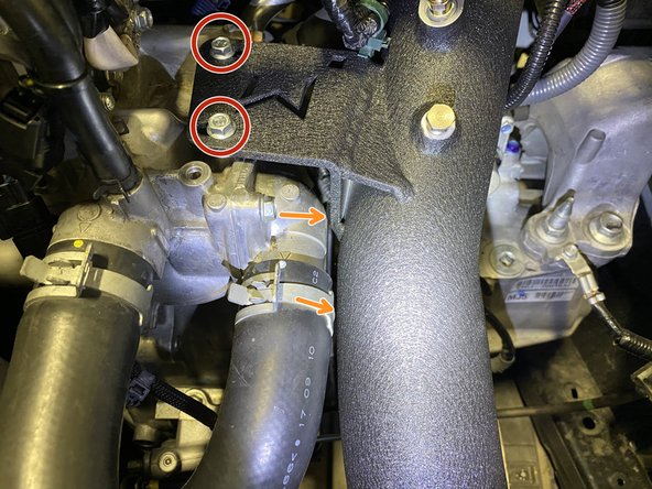 Install the provided M6x1.0x20mm flange bolts through the 27WON cold pipe mounting bracket into the engine