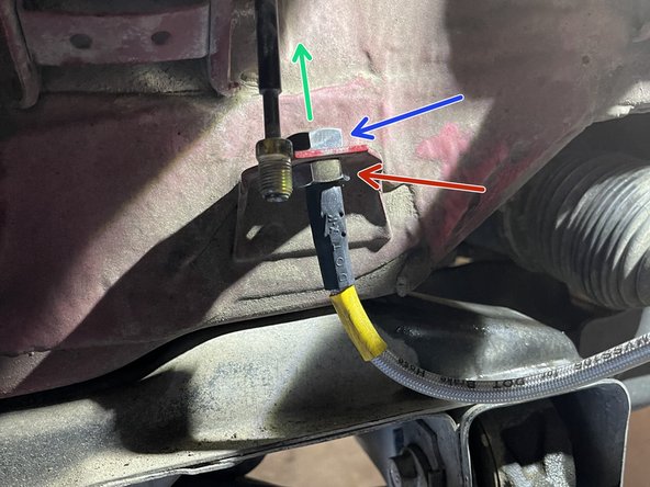 Remove the large 19mm nut from the same brakeline