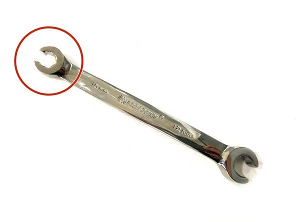 It is critical to use a Line Wrench to loosen the brakeline connection.  Using the open end of a standard wrench may round over the corners