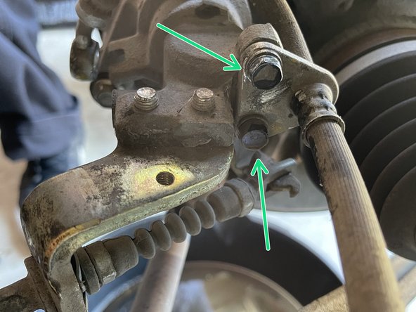Using a 12mm socket with a 3/8&quot; ratchet, remove the banjo bolt holding the OEM brake hose to the caliper so it can drain into the drain pan while disassembling
