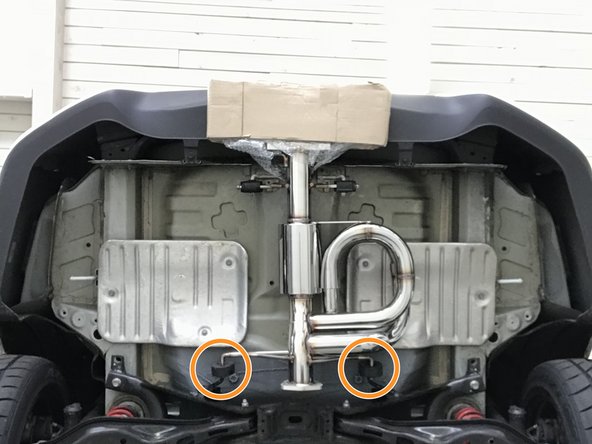 Insert both forward hangers as shown