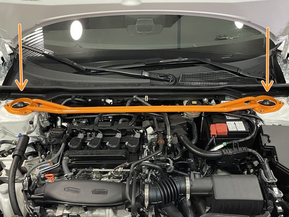 Place each end of the strut bar down on the strut tops over the studs