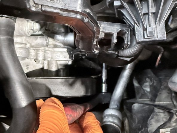 Use a 10mm wrench to remove the three bolts securing the OE BPV to the turbocharger