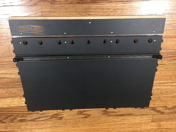Make sure the L brackets and steel support beam are flush with the sides of the Base panel as pictured.