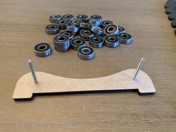 Double rollers go in the middle of the box and are shared by two adjacent spools.